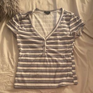 white shirt, with black gray and blue strips on it